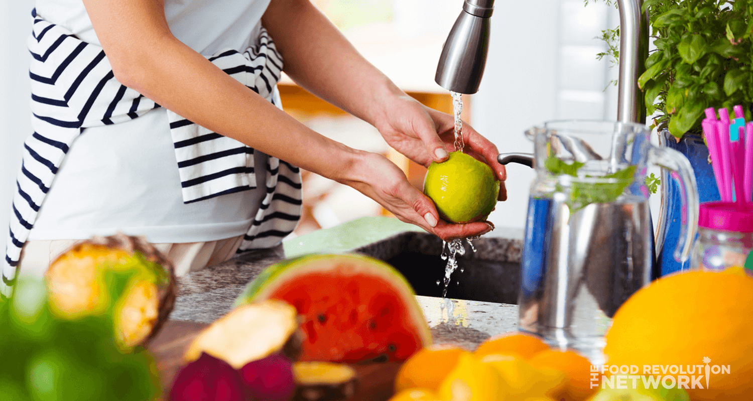 A woman washing produce