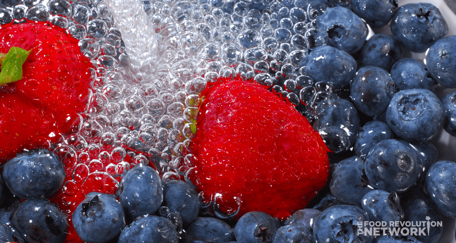 Washing fruit - blueberries and strawberries