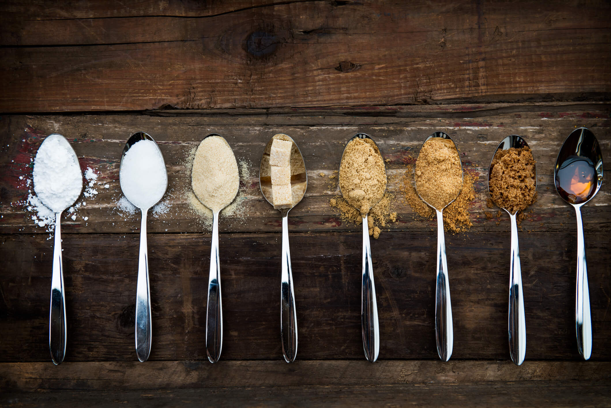 Different types of sugar in spoons