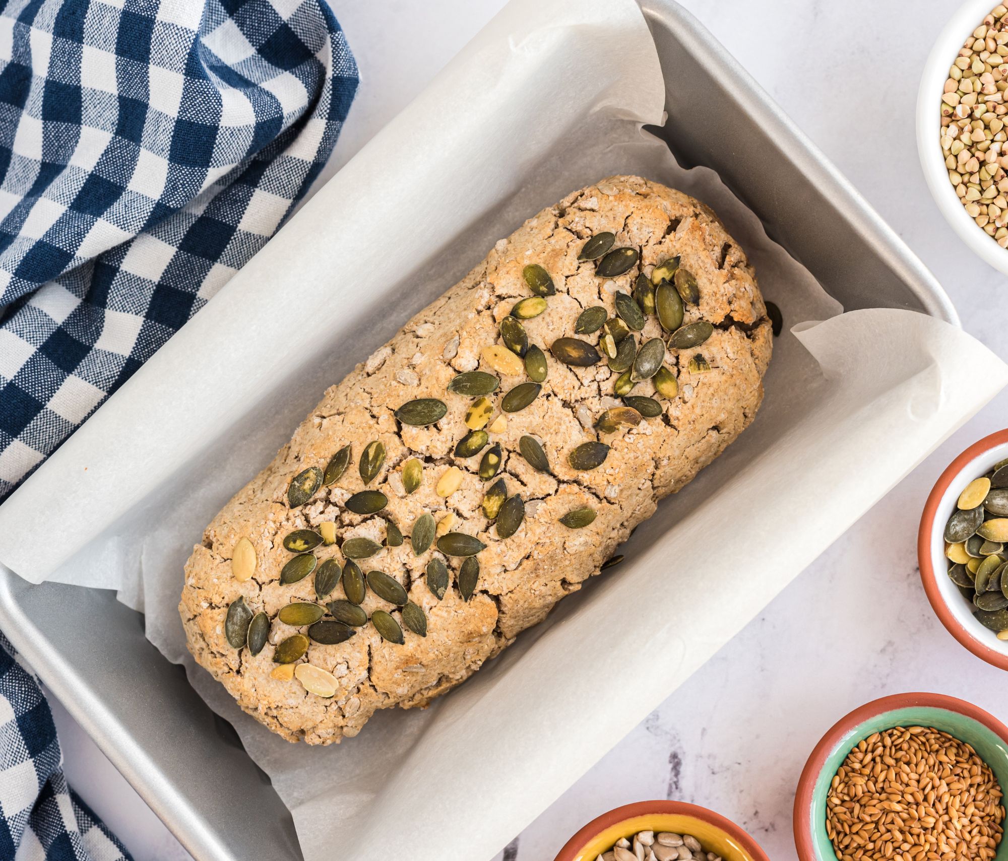 3 Seed Fermented Buckwheat Bread in a white baking dish