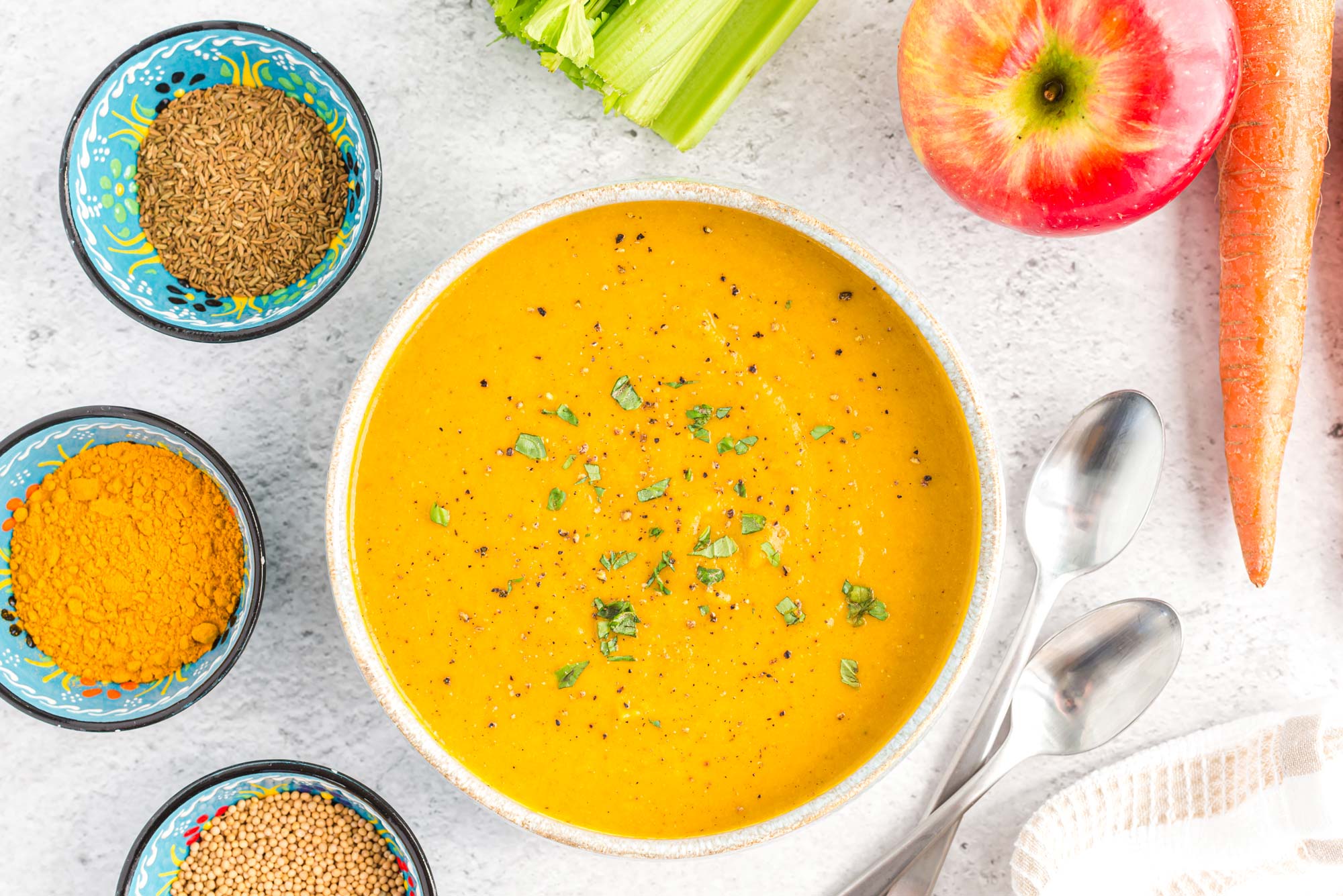 apple spiced ginger carrot soup in bowl