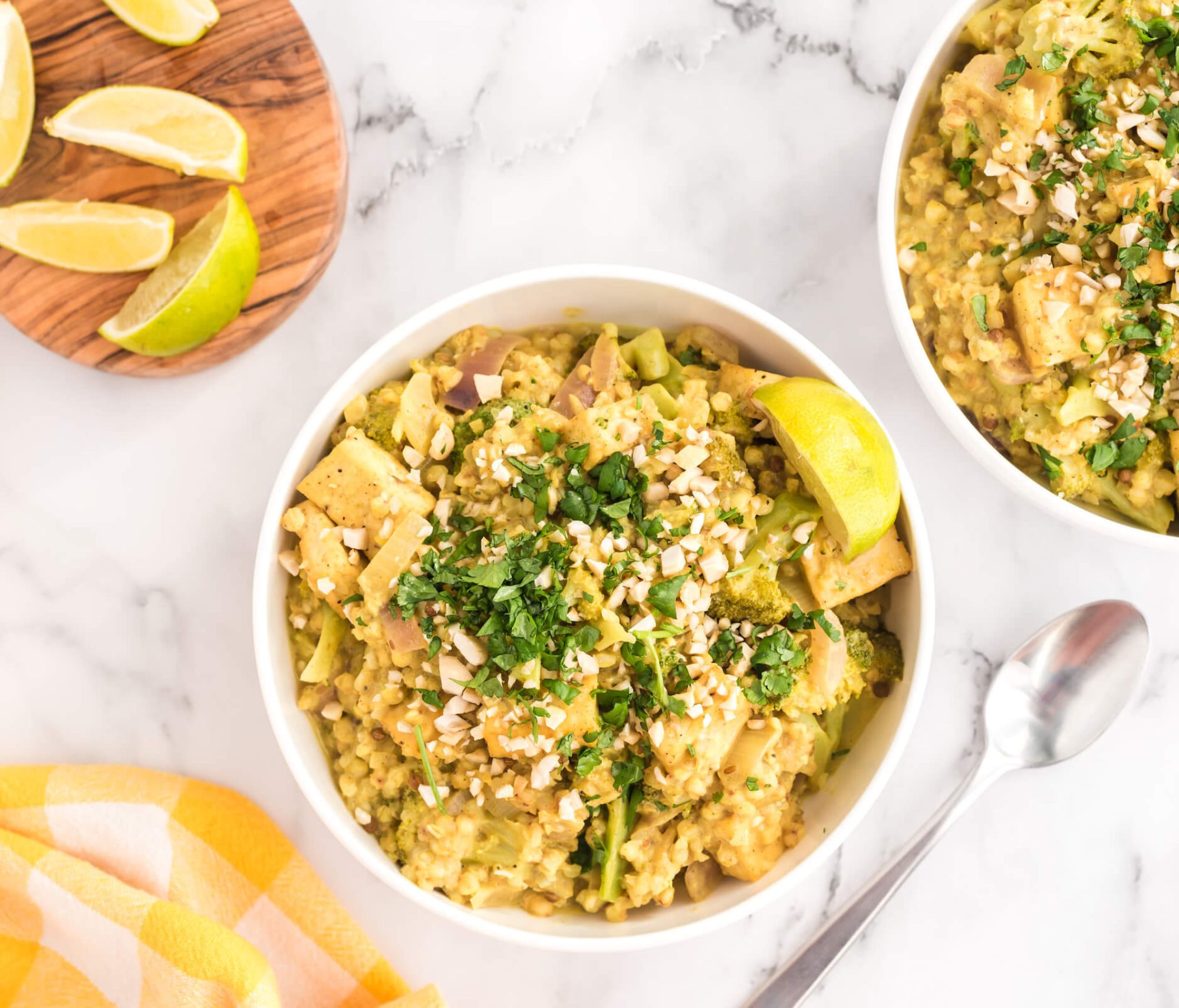 Buckwheat Tofu and Broccoli Curry in a bowl on top of a kitchen counter