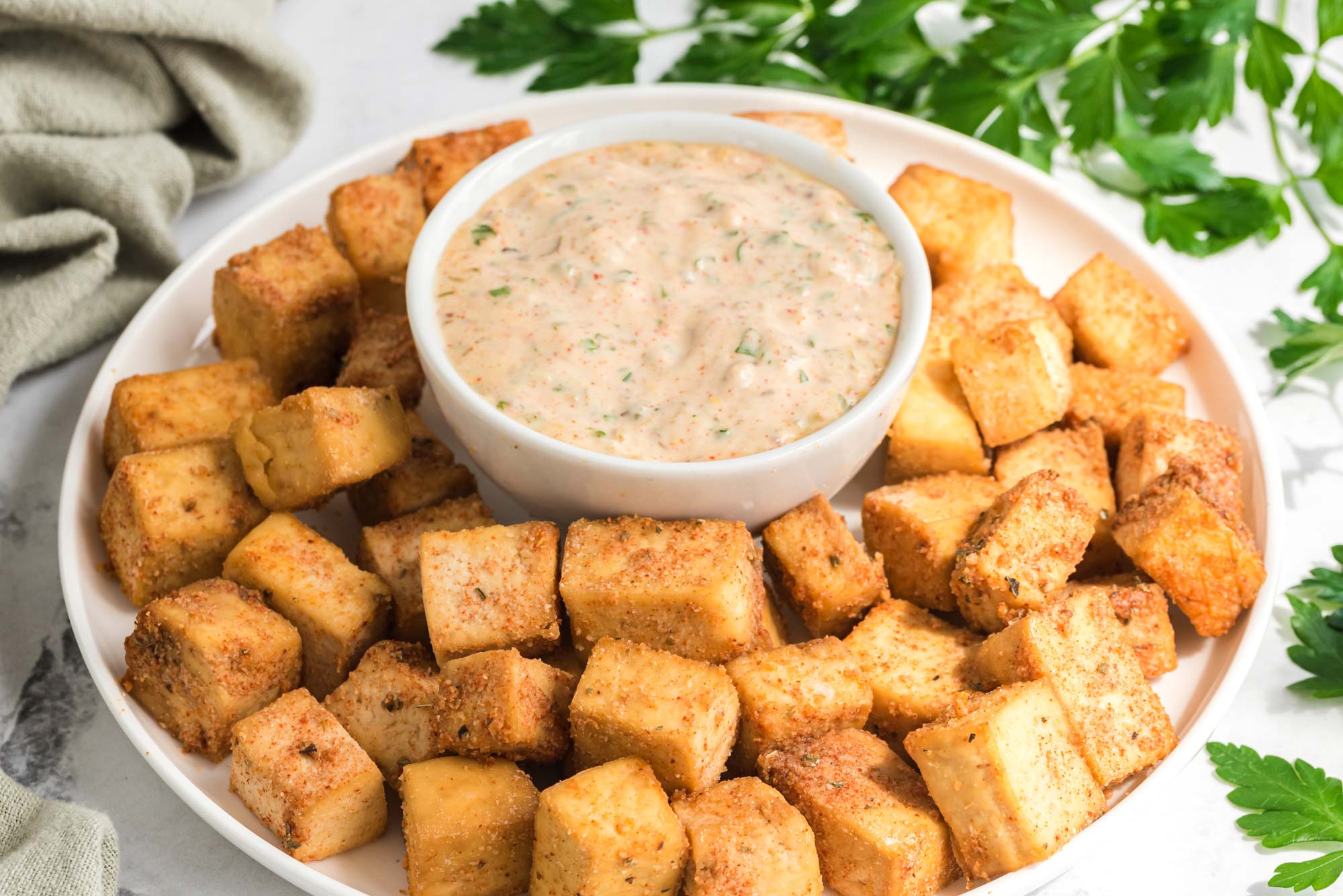 crispy cajun tofu bites in serving dish