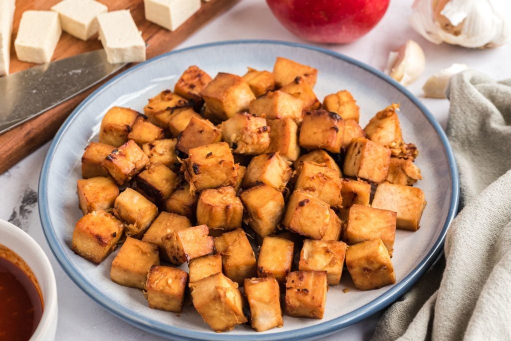 Crispy Korean Tofu Bites on a blue dish