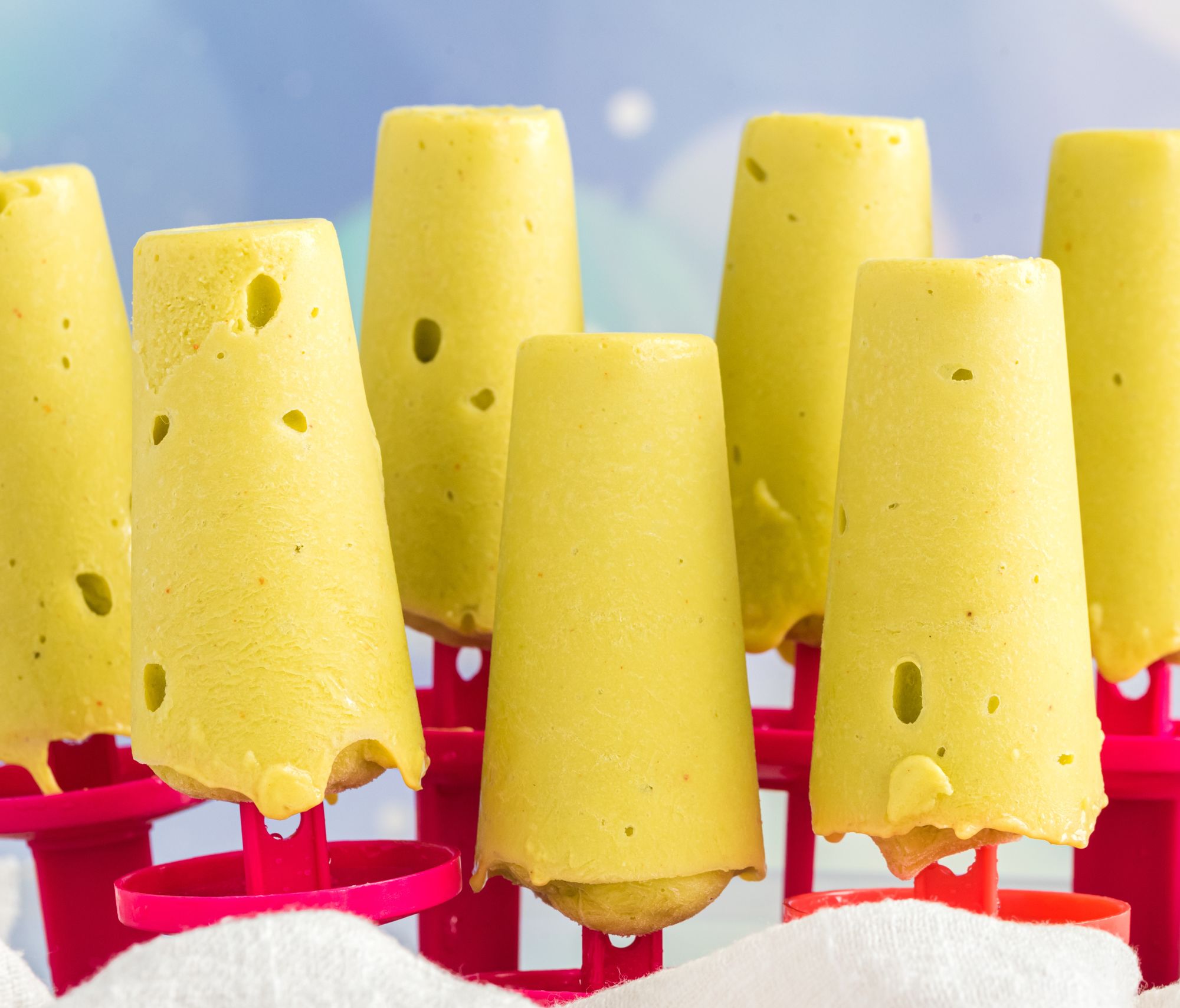 Mango Chili Pops on a red plastic holder