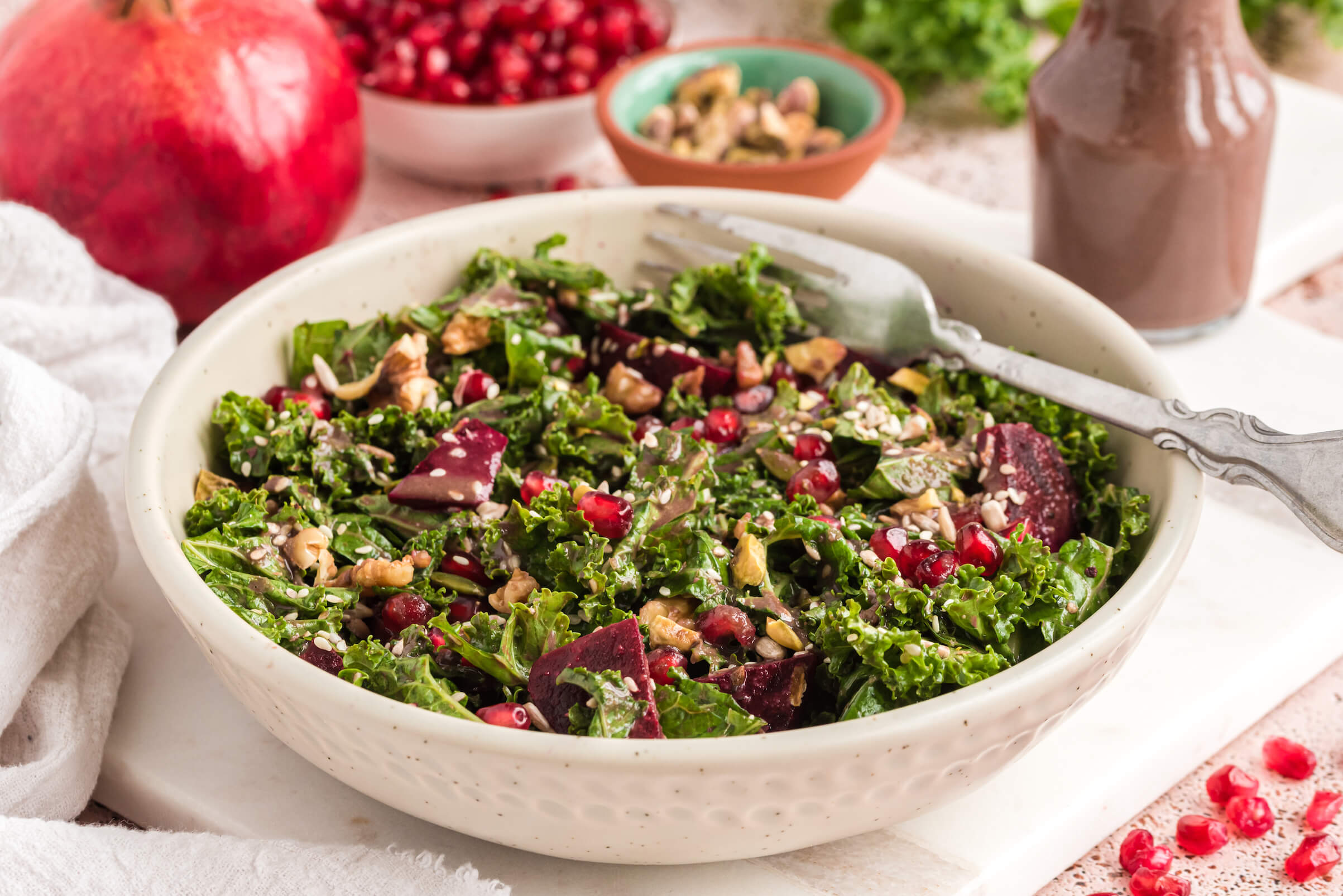 Nutty and Seedy Kale Salad with Pomegranate Vinaigrette