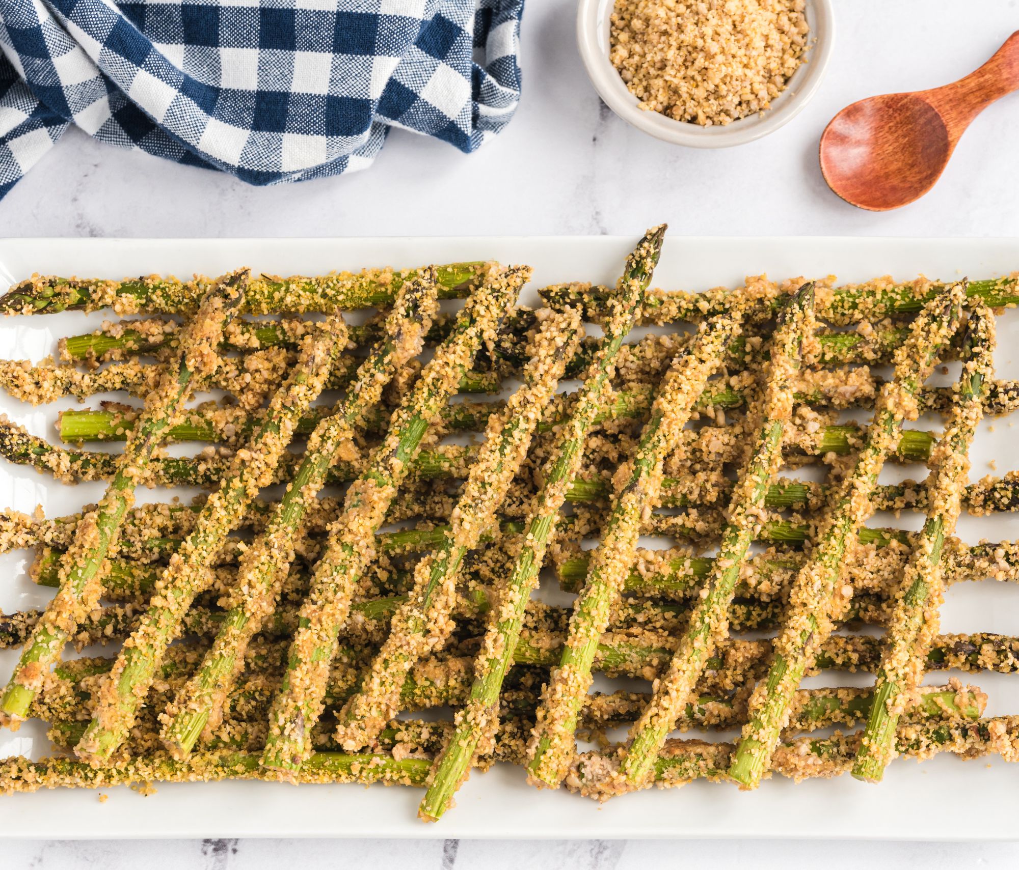 Parmesan Crusted Asparagus on a white tabletop