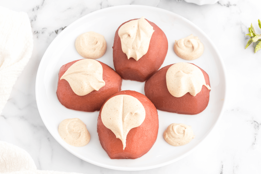 Pomegranate poached pears with cream