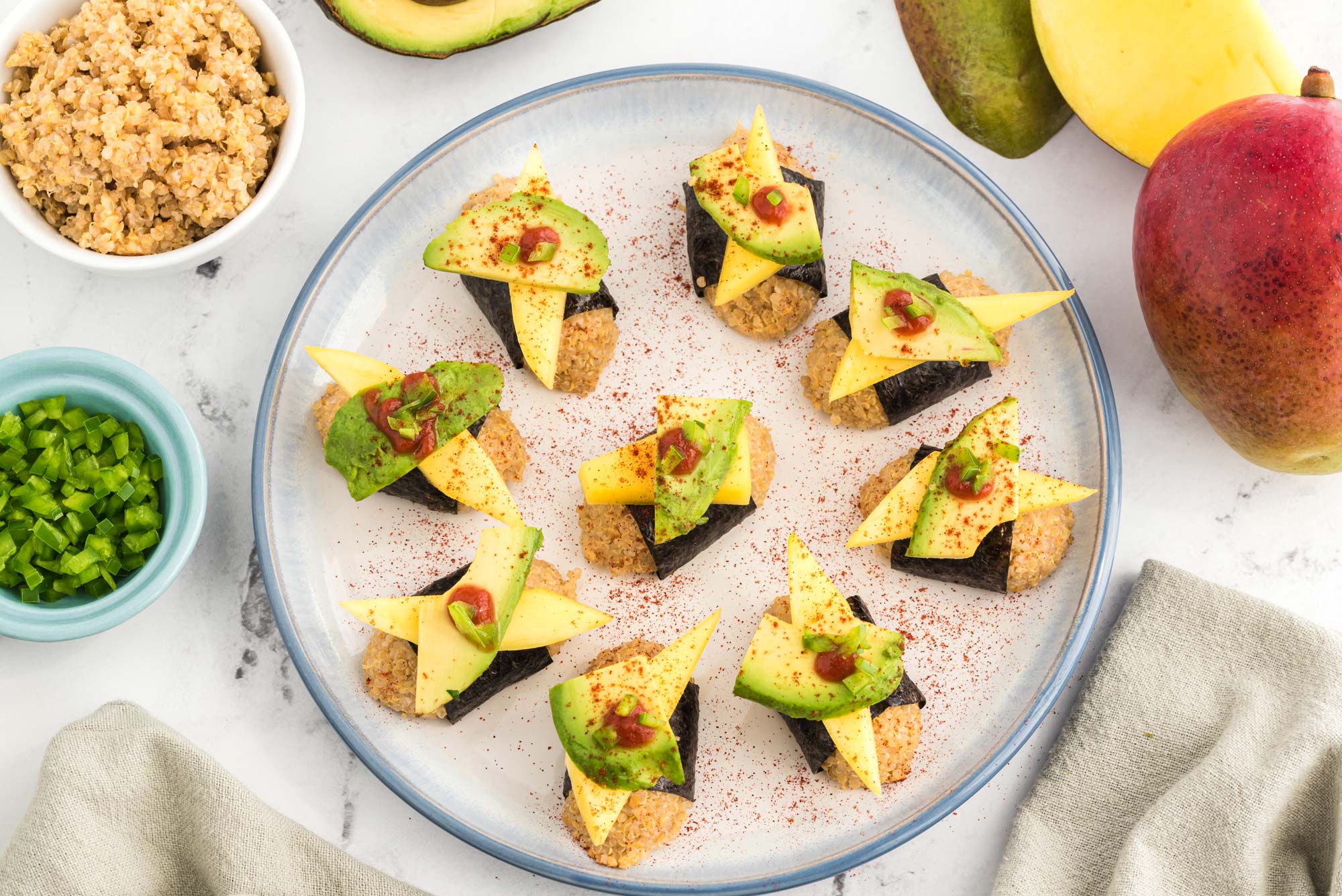 avocado and mango quinoa nigiri on plate