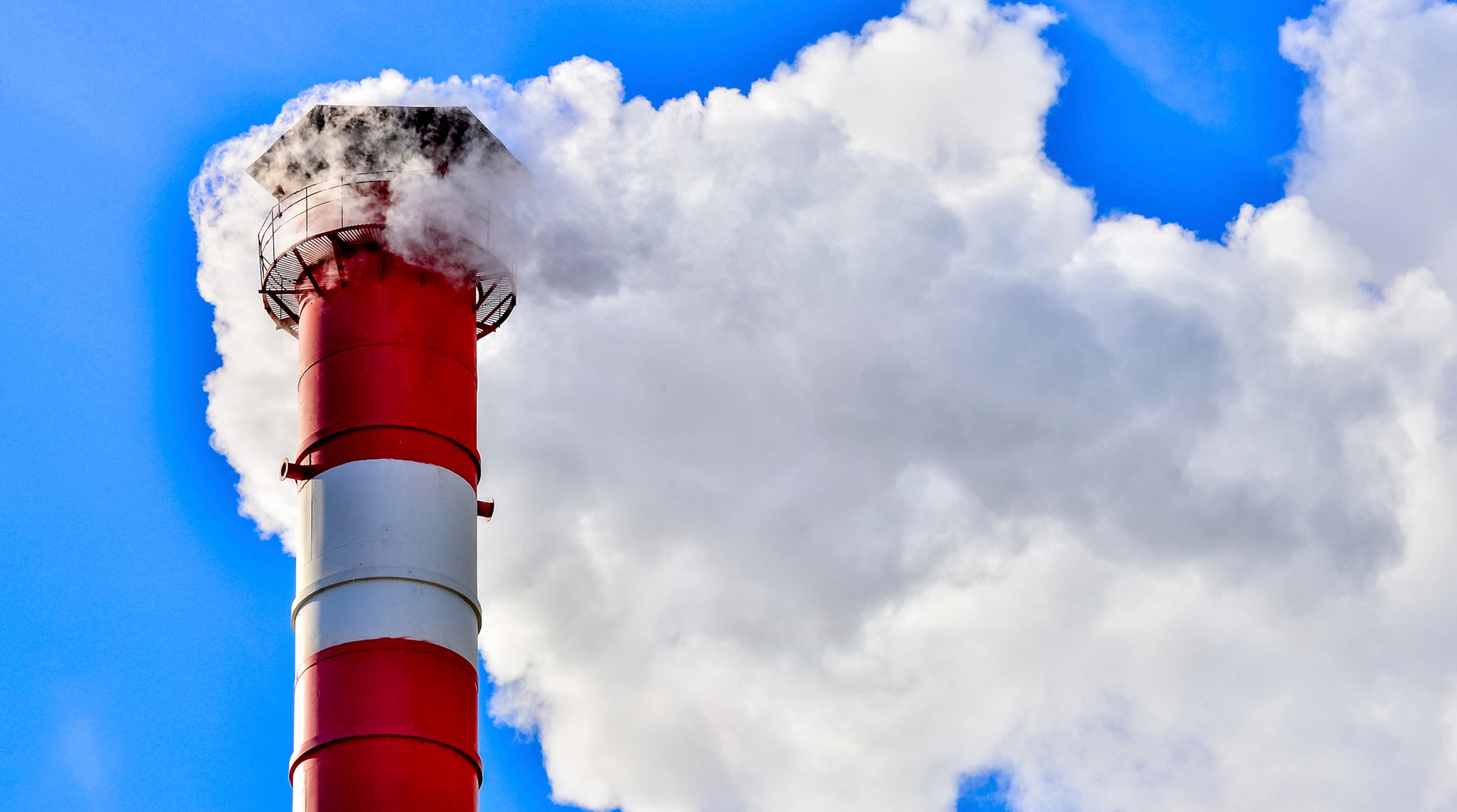 A smoke stack with smoke