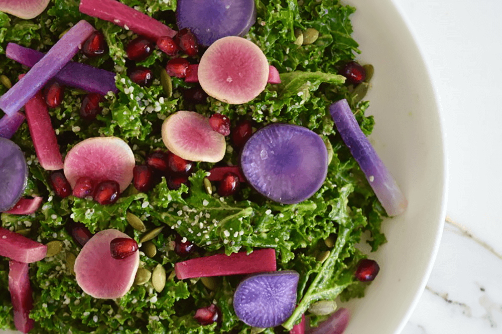 bowl of green and purple salad