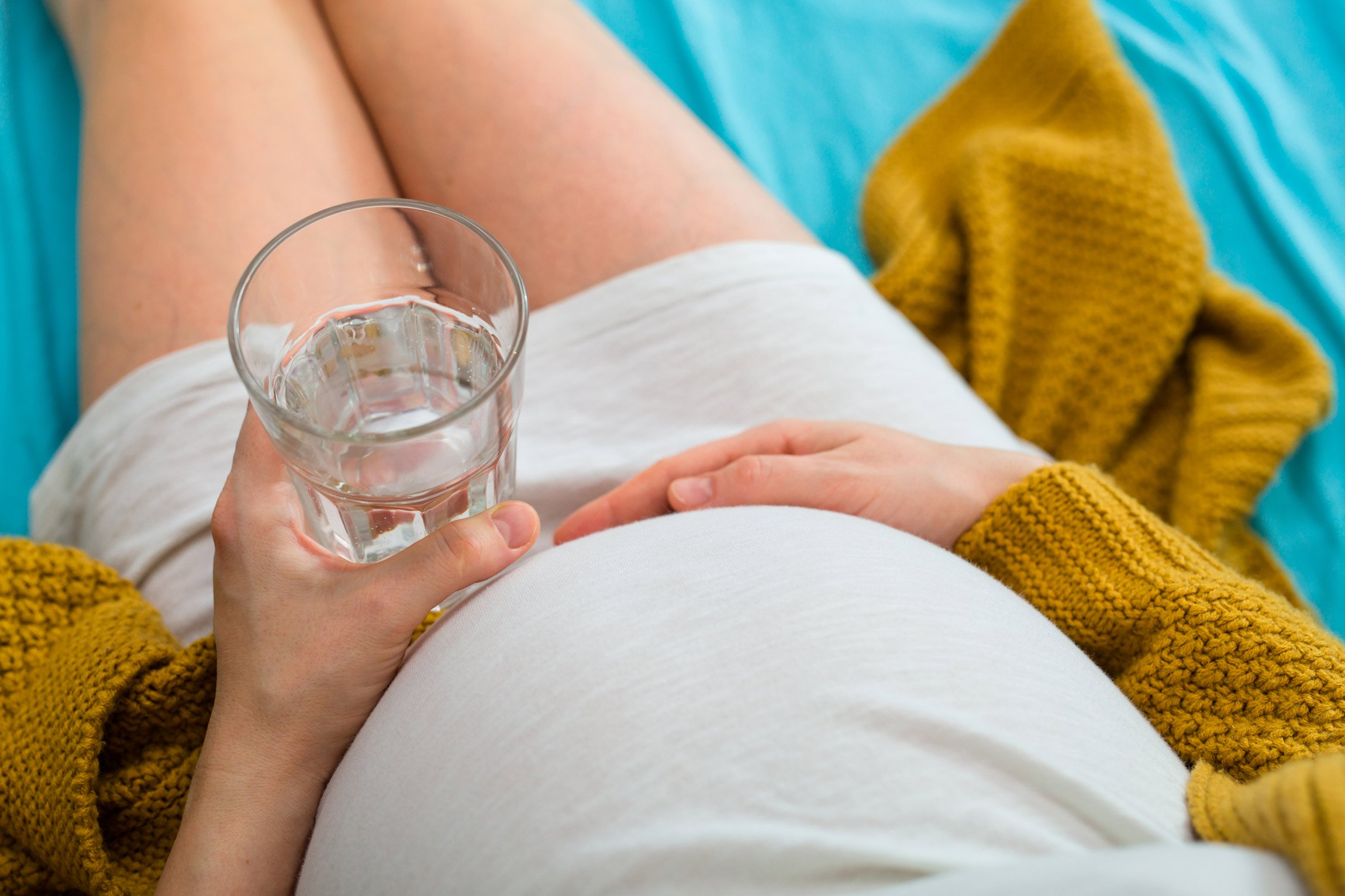 Pregnant woman with a glass of water