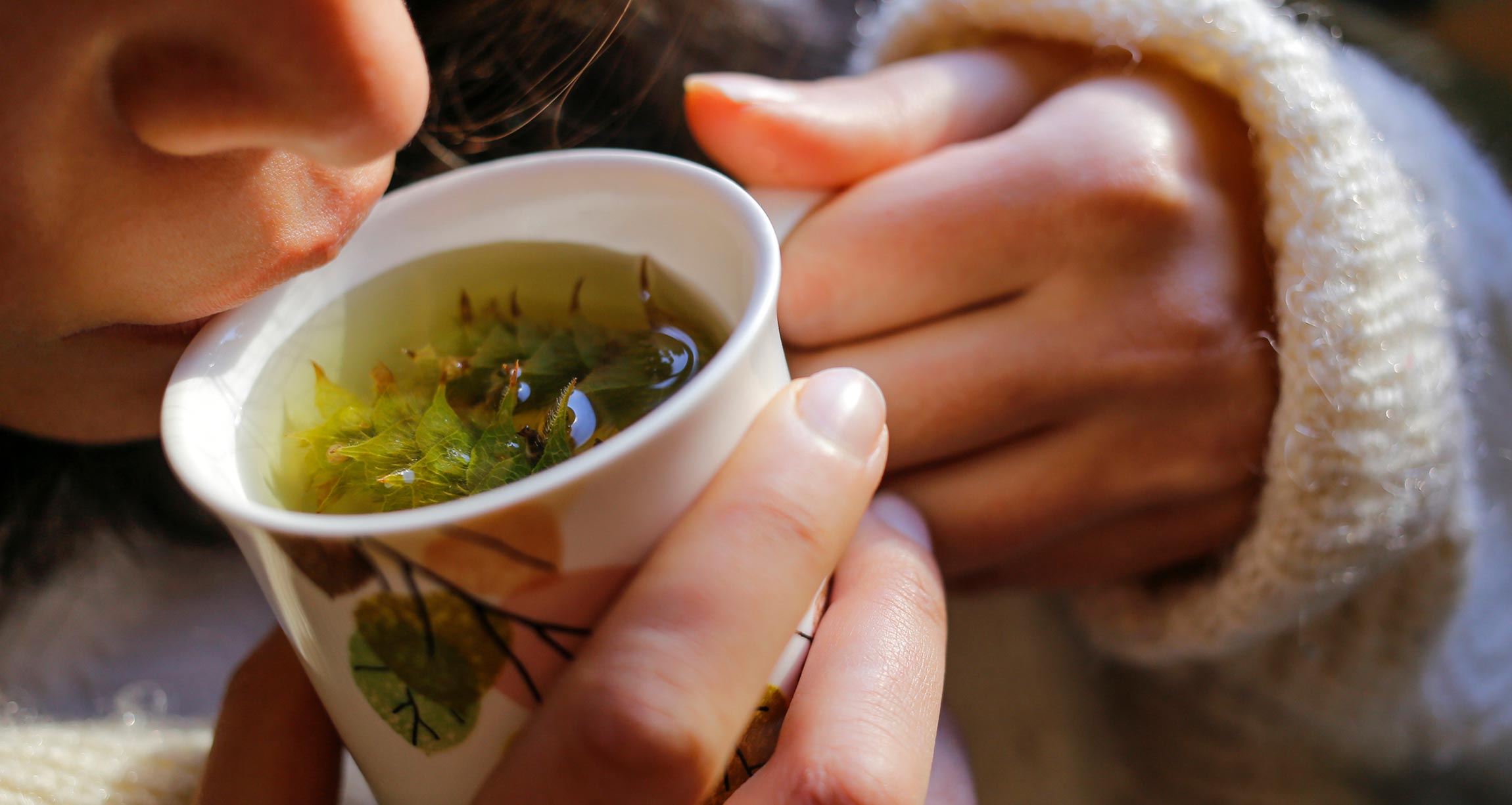 woman drinking sage tea