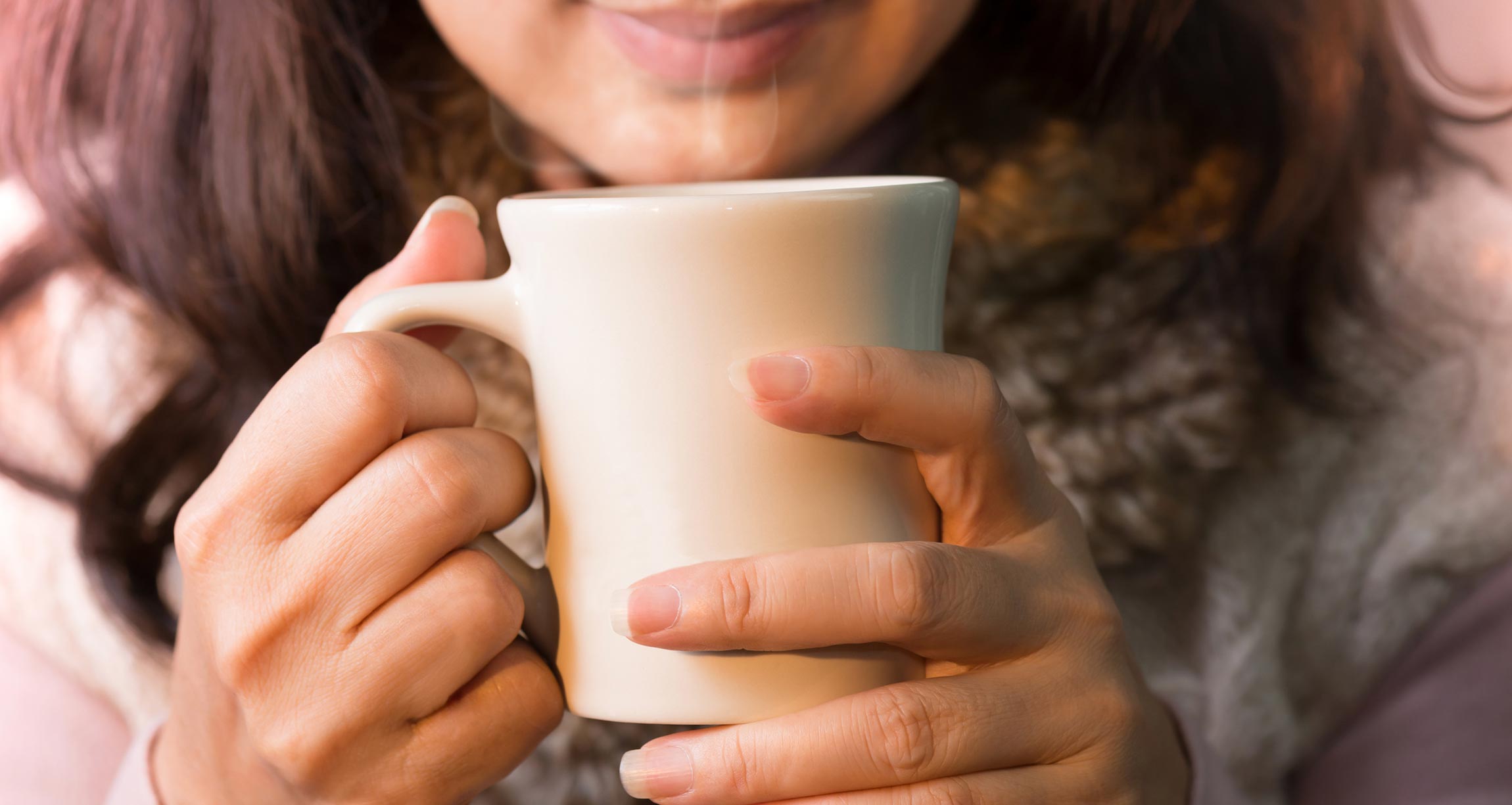 woman holding mug