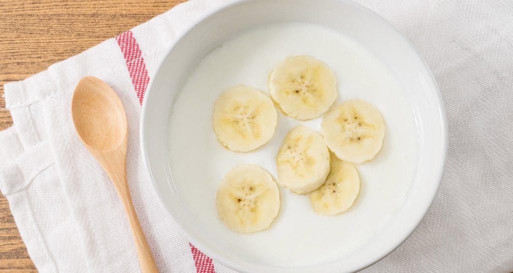 bowl of yogurt with banana slices
