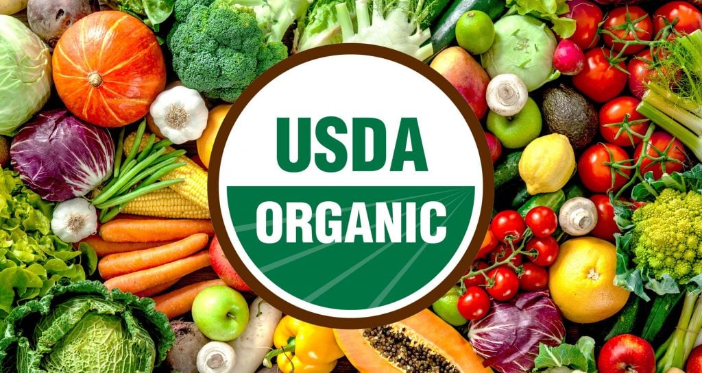 USDA organic logo on top of variety of fruits and vegetables