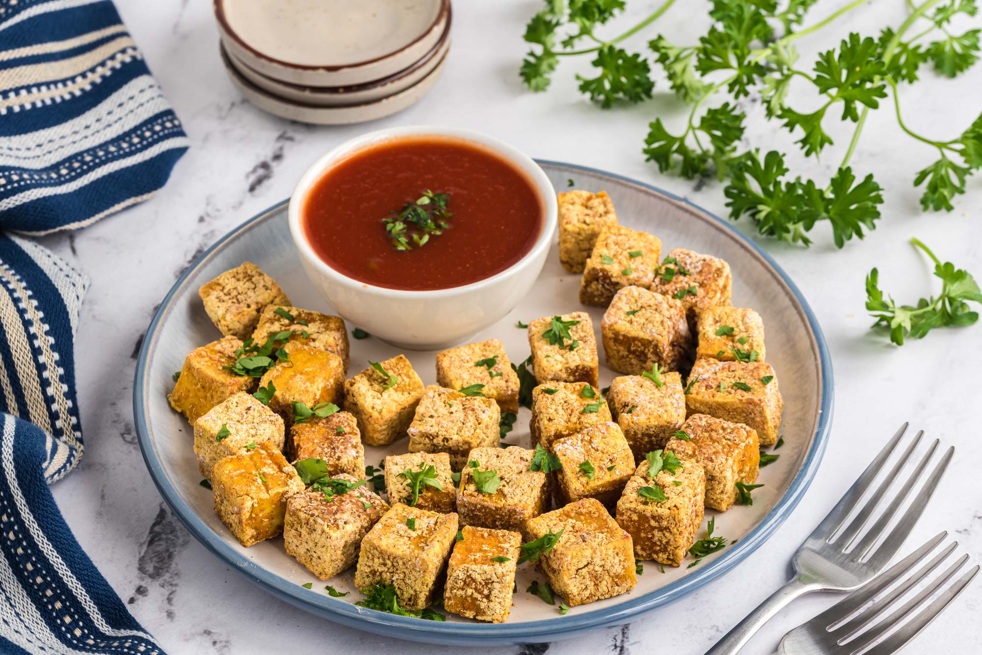 crispy tofu poppers with mango sauce on plate