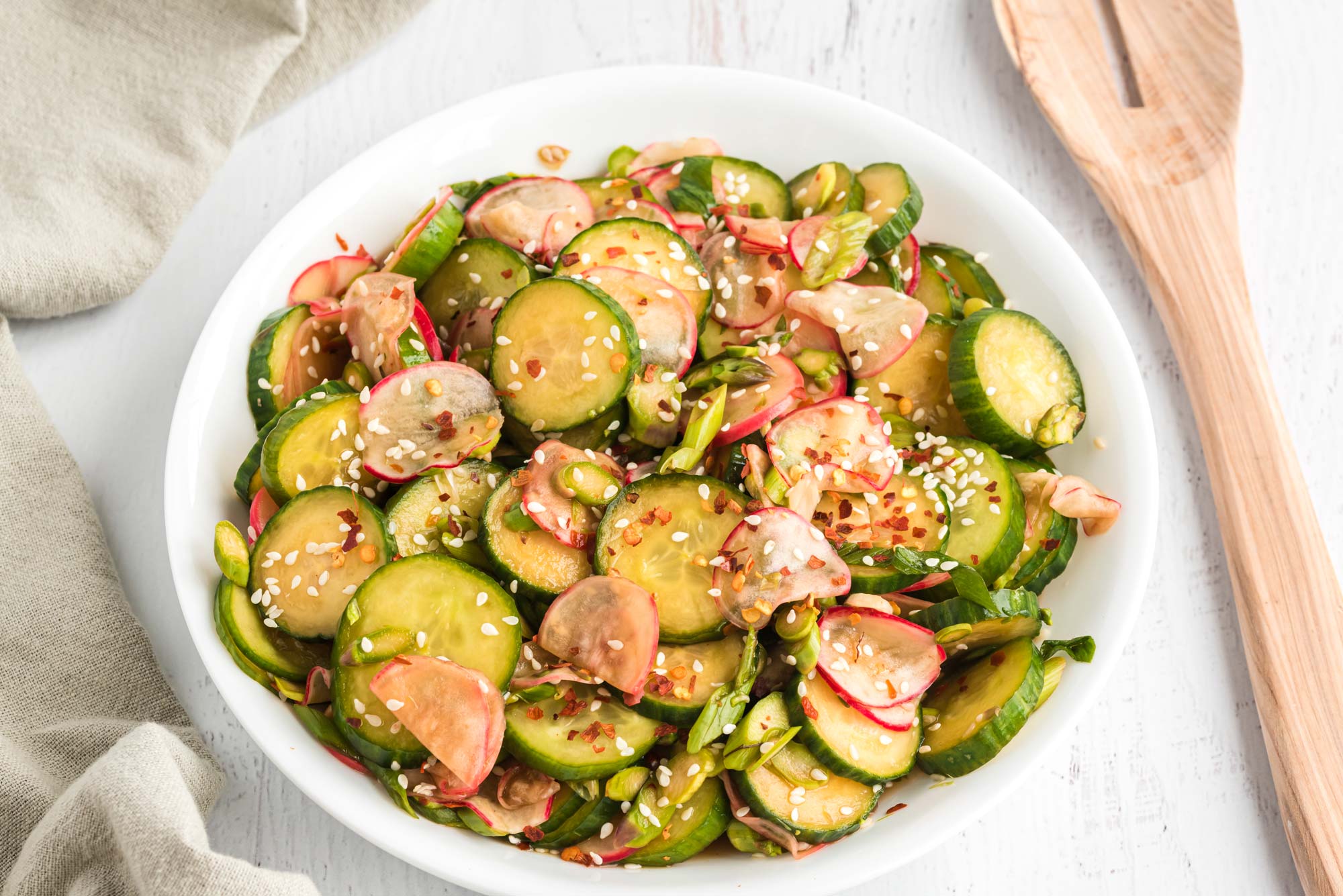 cucumber asparagus and radish salad in bowl