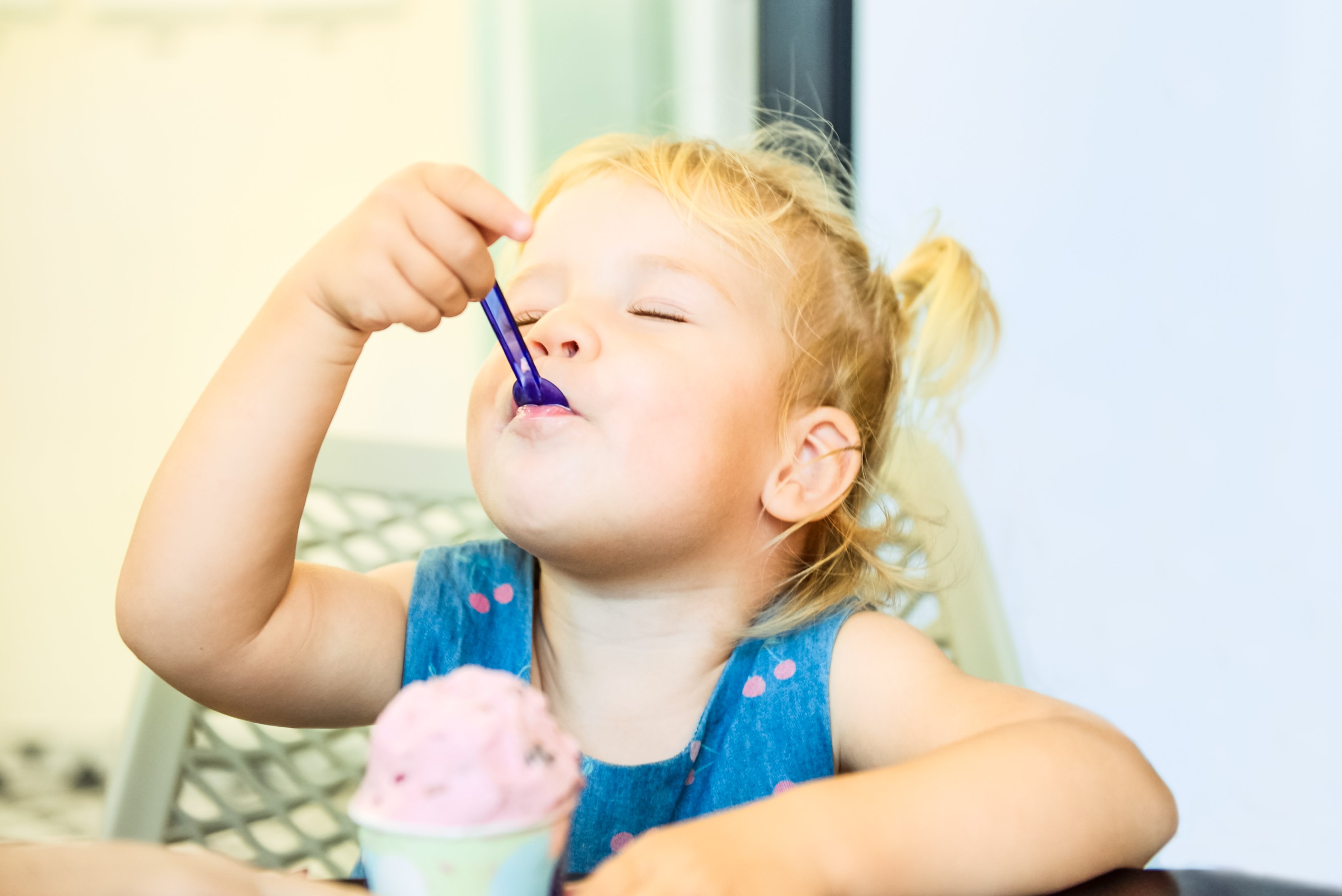 Little girl eating ice cream