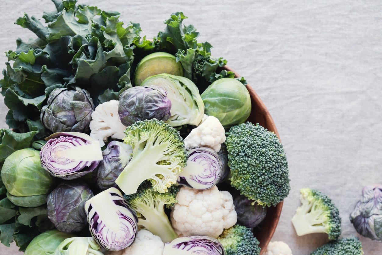 cruciferous vegetables, cauliflower,broccoli, Brussels sprouts, kale in wooden bowl, reducing estrogen dominance, ketogenic diet