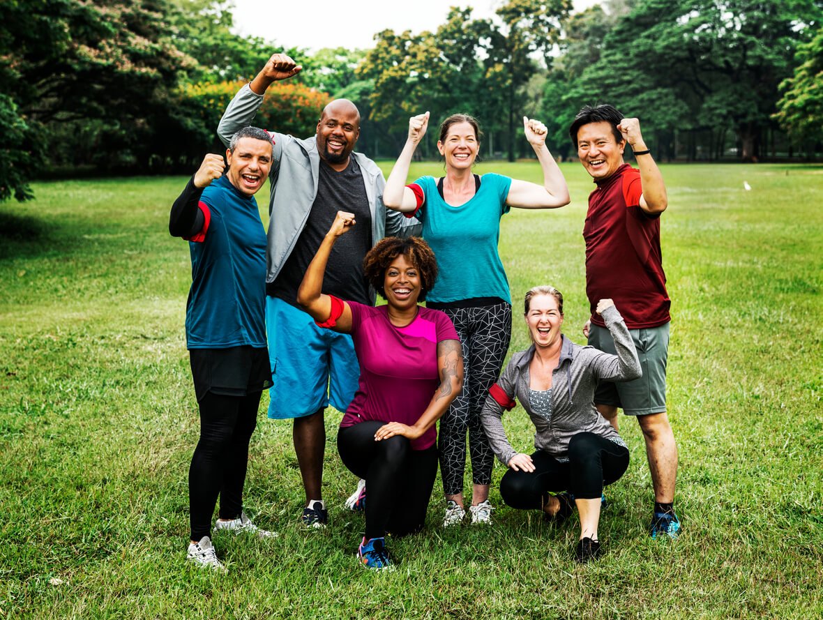 group of cheerful diverse friends in the park