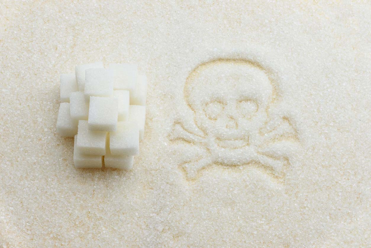 sugar cubes next to toxic symbol drawn in sugar