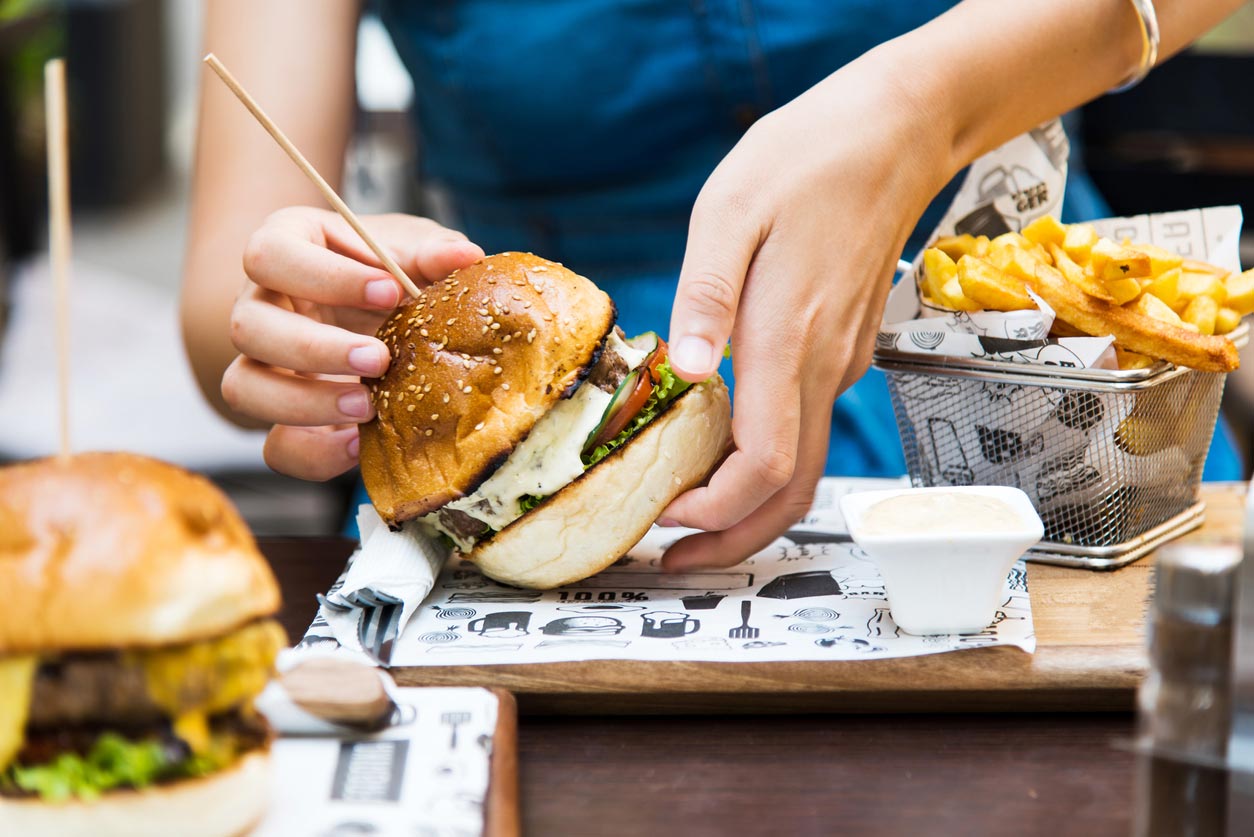 girl handling burger