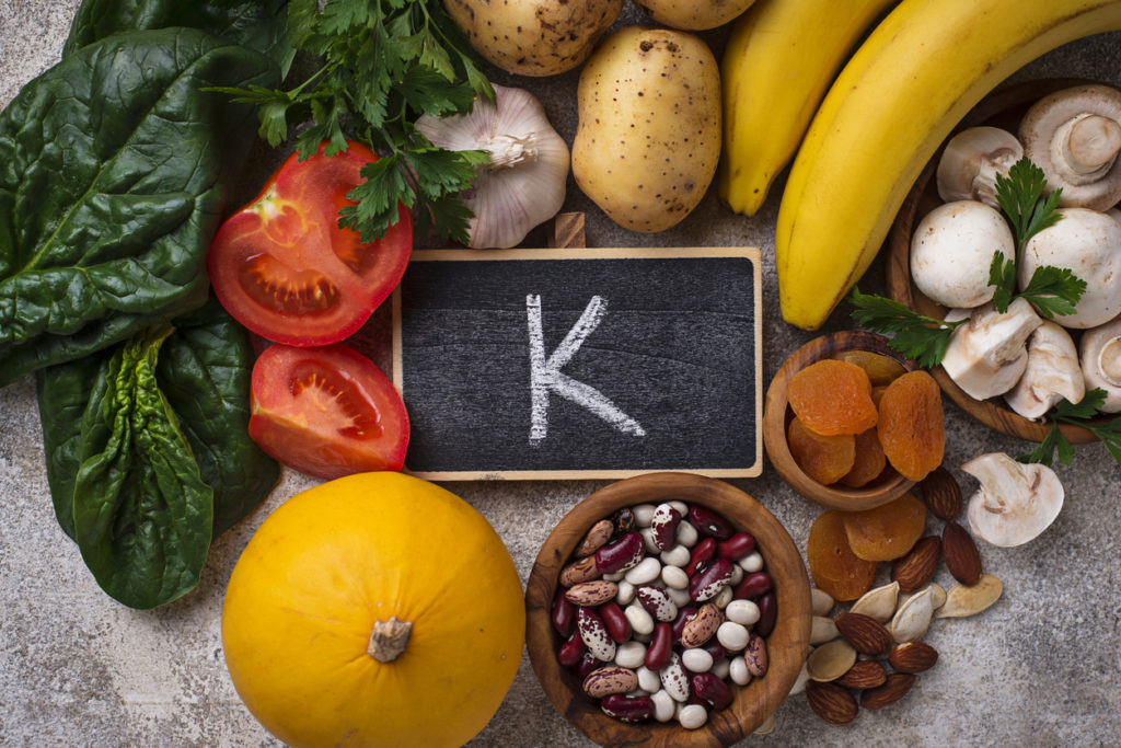K - the symbol for potassium - surrounded by potassium foods