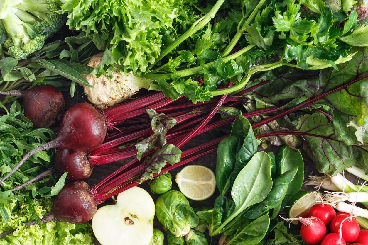 healthy food ingredients background vegetables fruit herbs top view