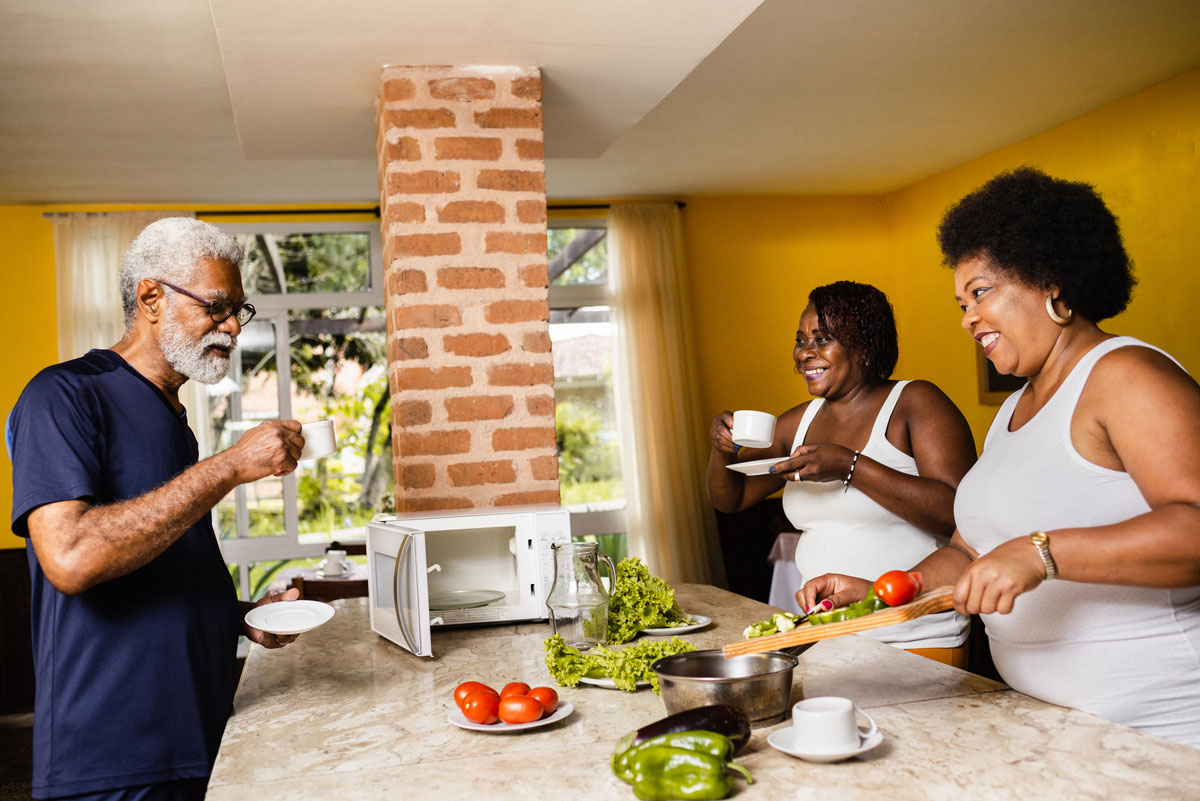 family and vegetables around microwave