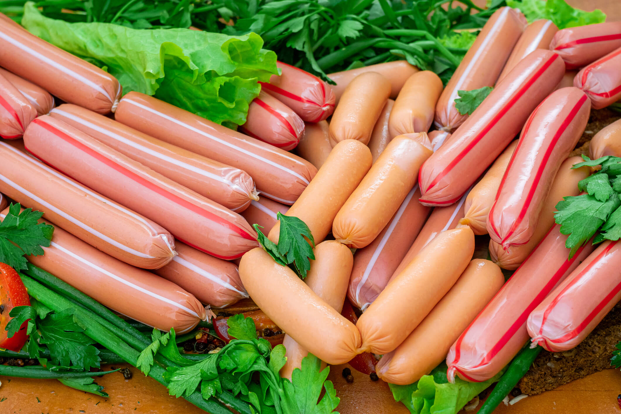 stack of sausages with greens closeup