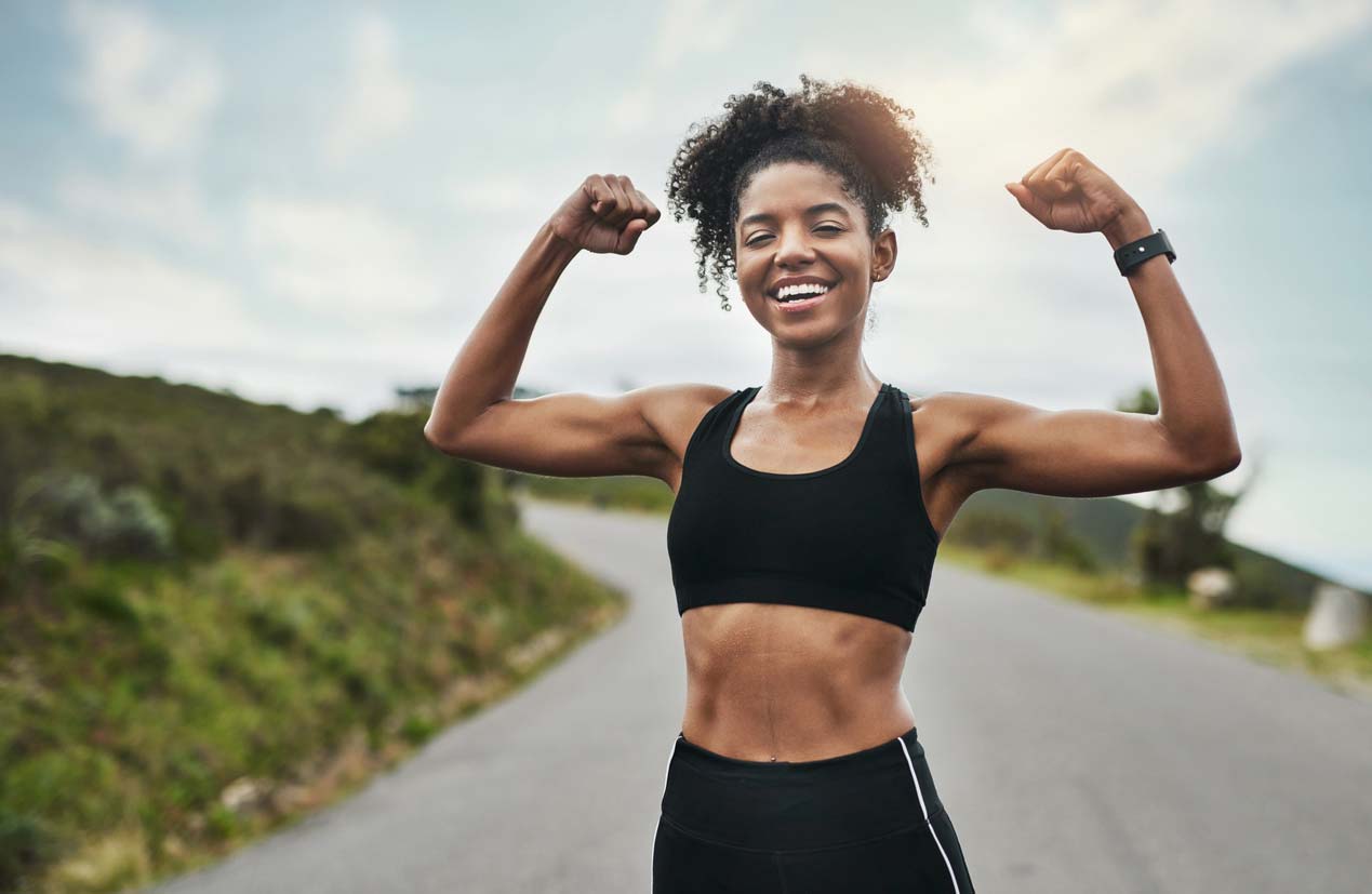 Female runner showing her muscles