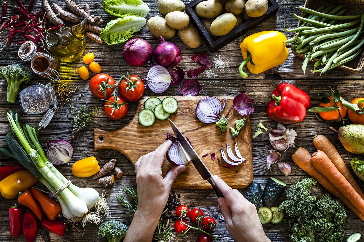 Making a vegan charcuterie board and cutting up vegetables