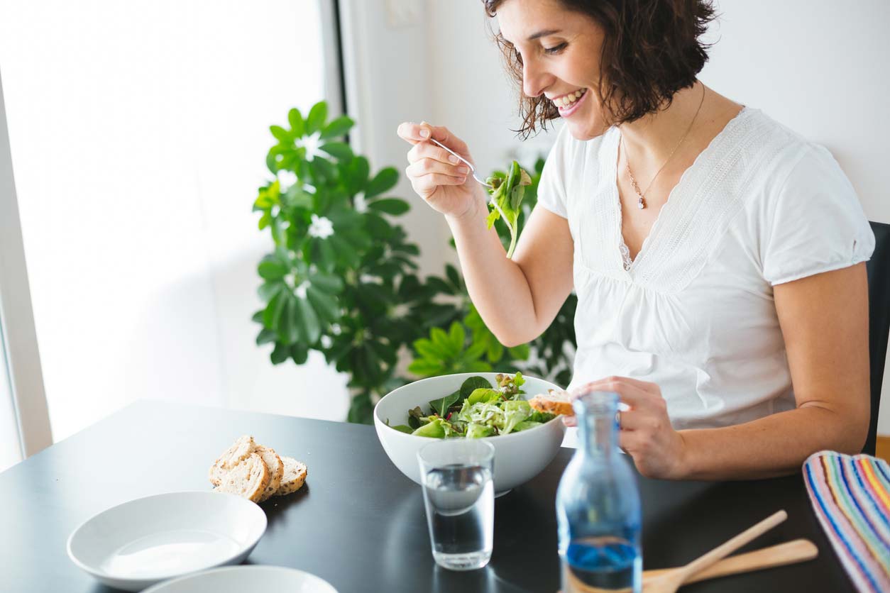 happy woman enjoying salad