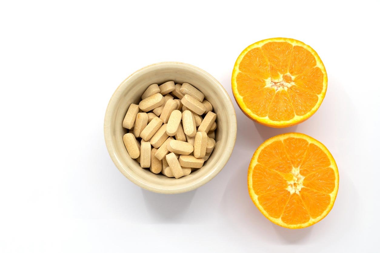 vitamin c supplement with orange halves