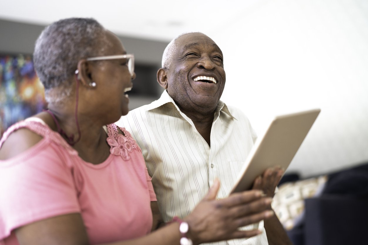 Senior couple using digital tablet