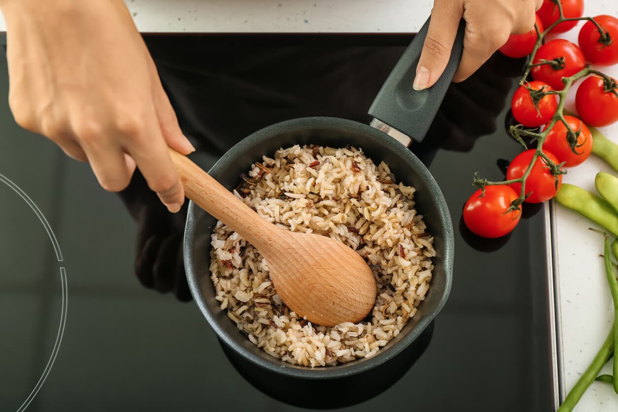 Meal prepping wild rice in a pot on the stove