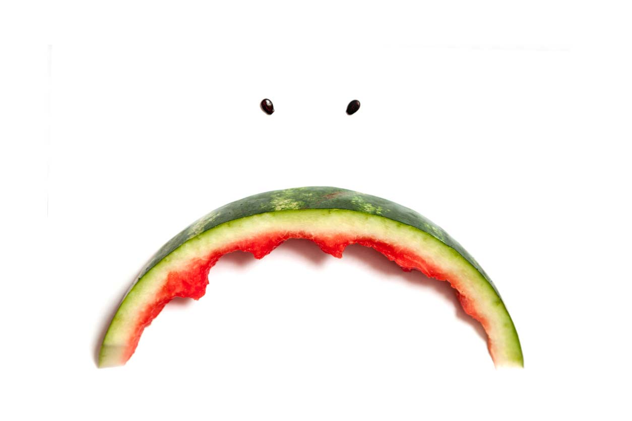 sad face made from watermelon rind and seeds