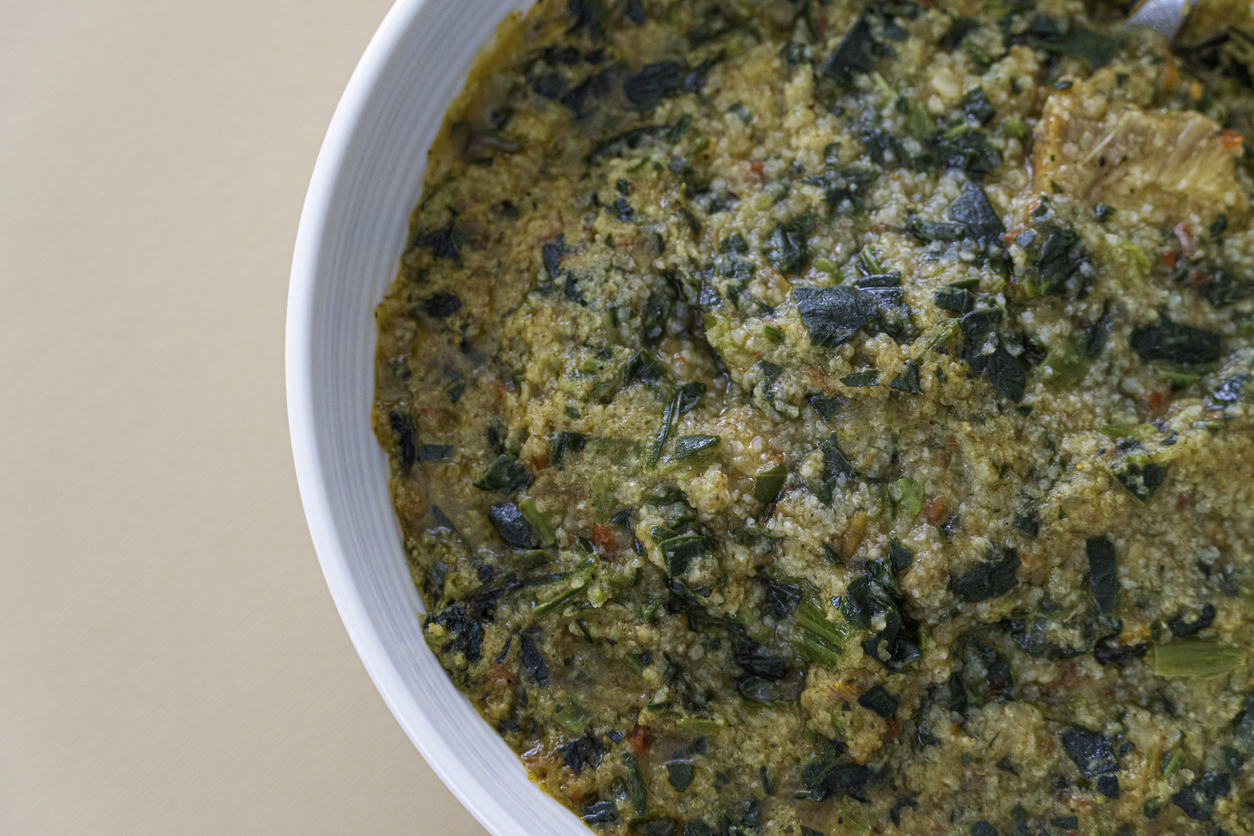 Nigerian Fonio Acha supper grain porridge prepared with vegetables and fish - Gluten Free