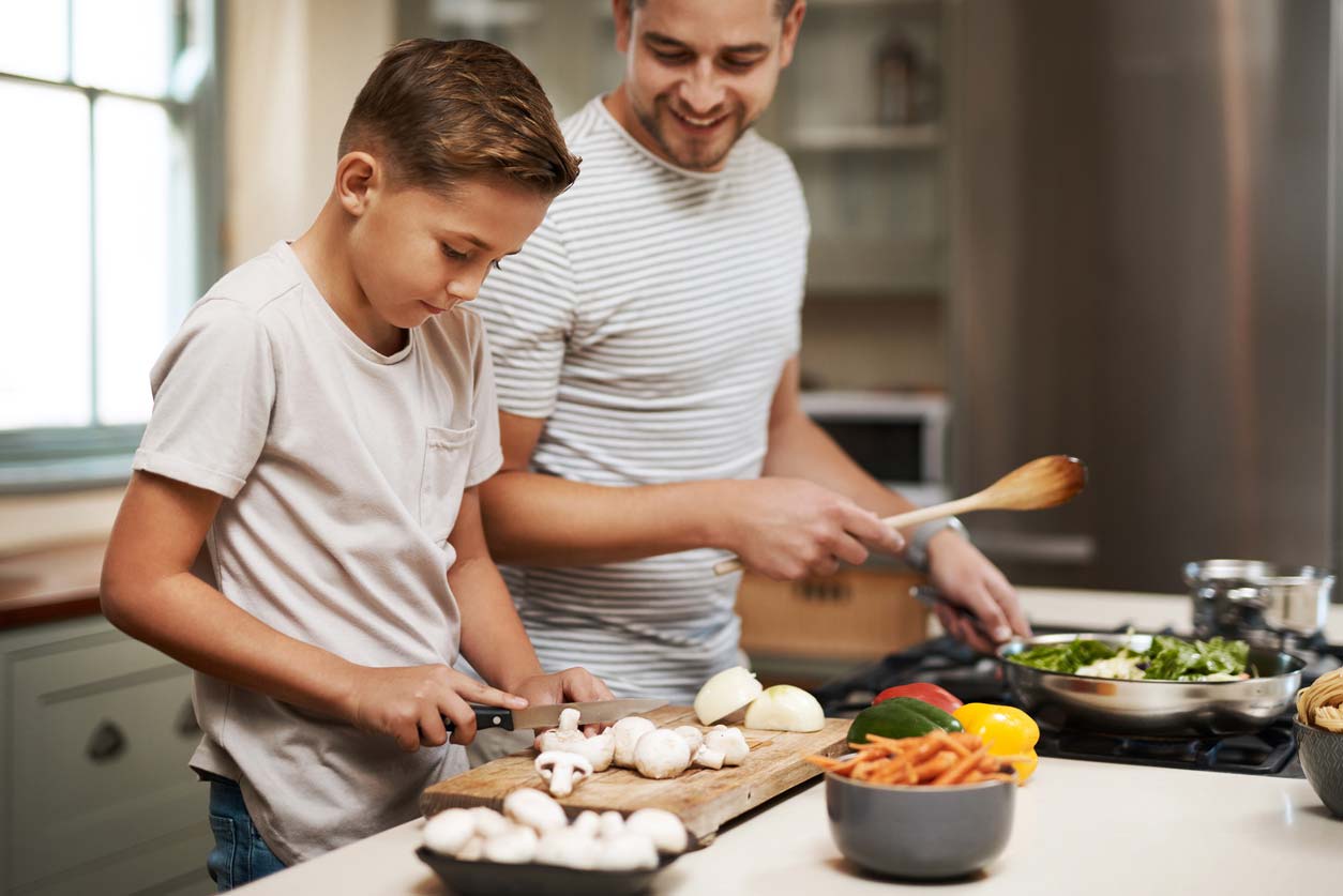 Brothers preparing meal with mushrooms