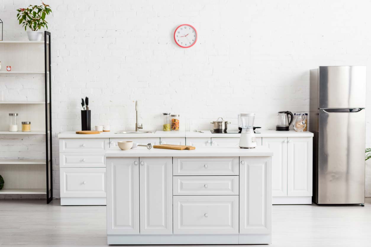 modern white kitchen with table and kitchenware