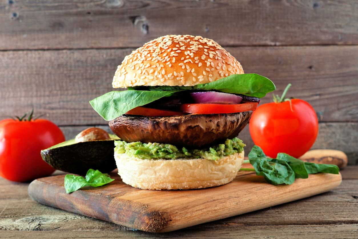 Portobello mushroom burger on cutting board