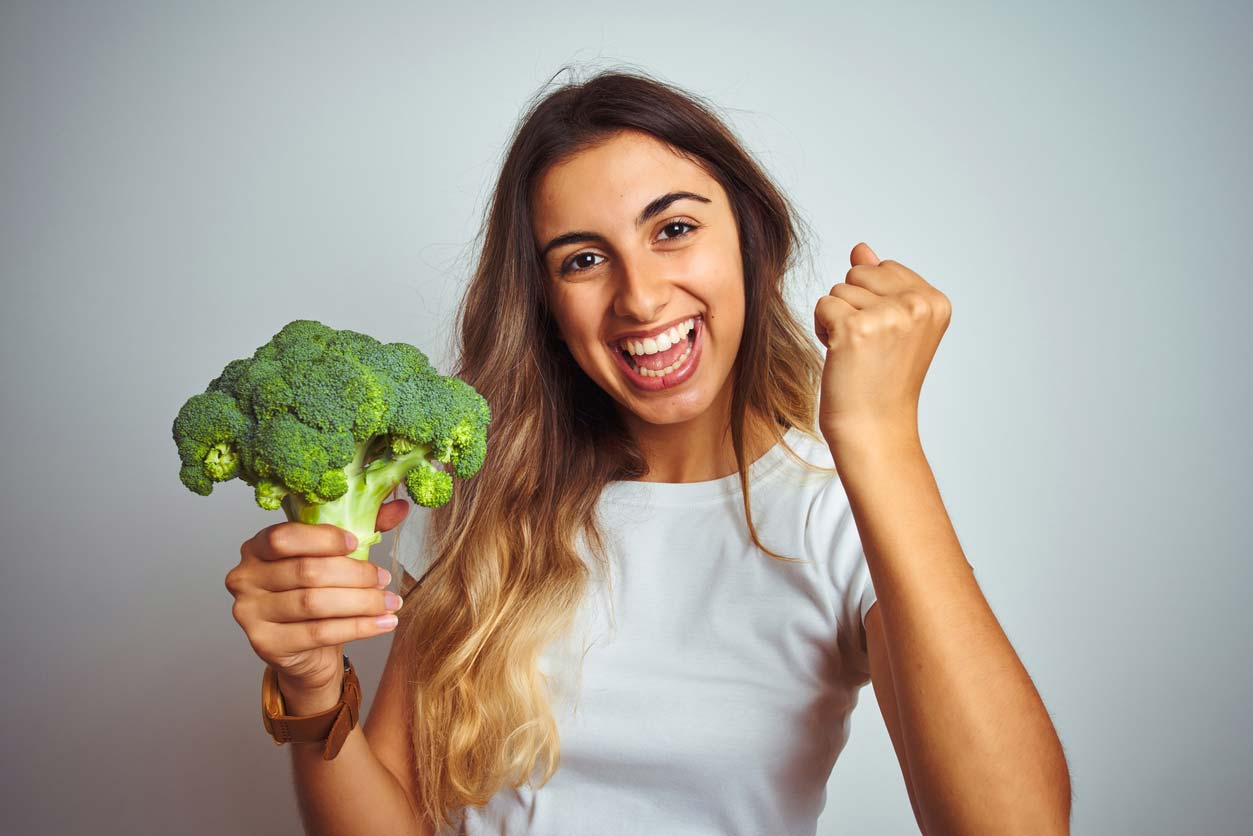 woman excited about broccoli