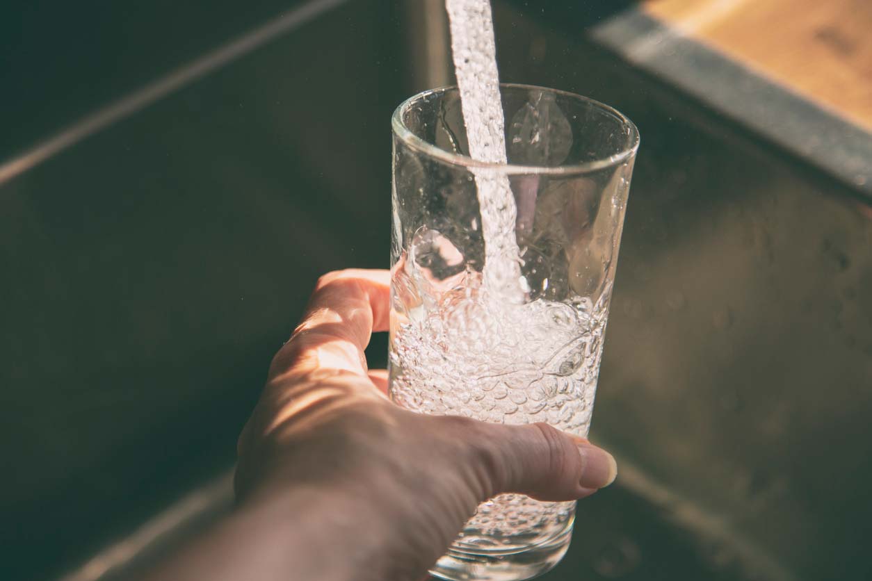 filling glass with tap water