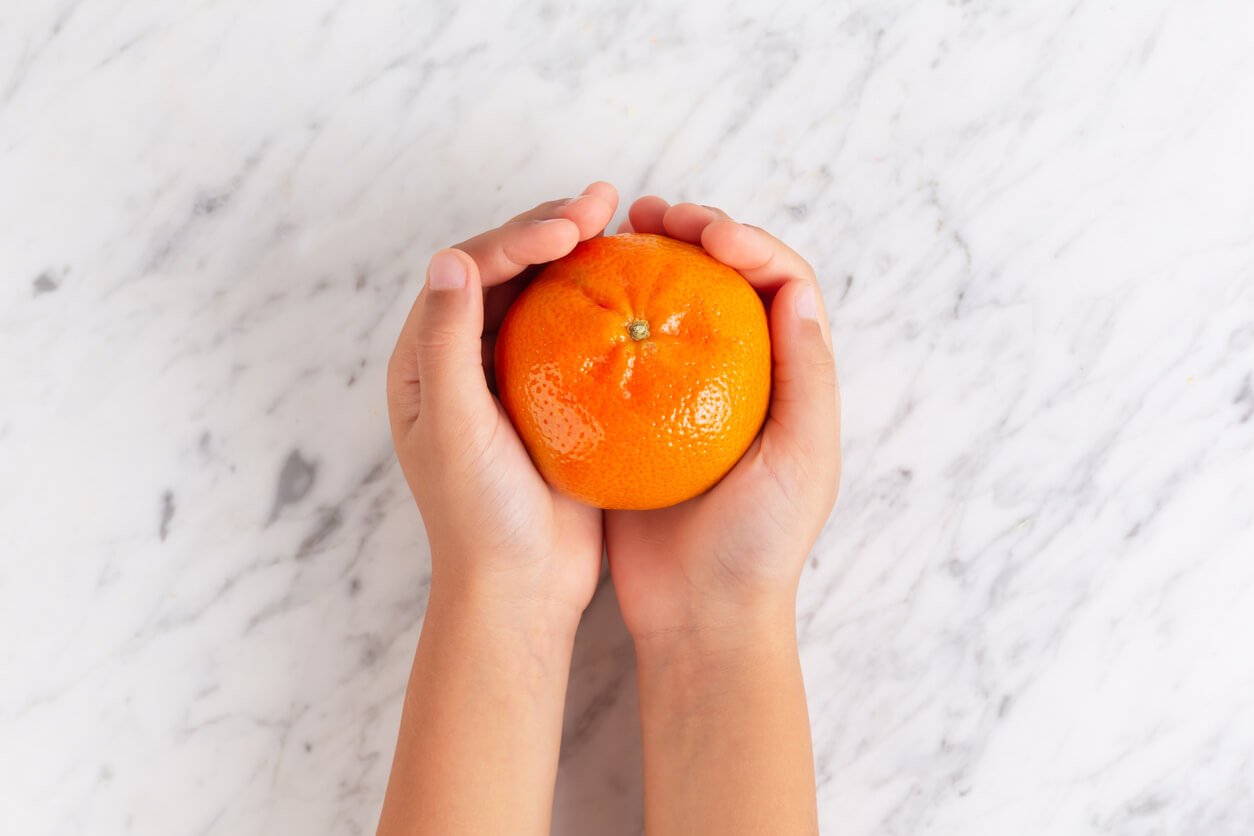 citrus fruits mandarin on a trendy stone background