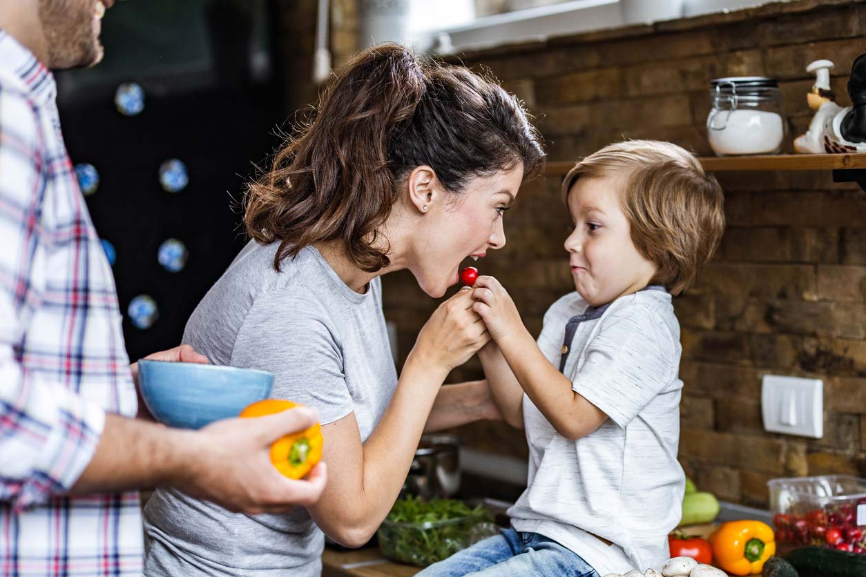 mom enjoying the benefits of cherries with her son