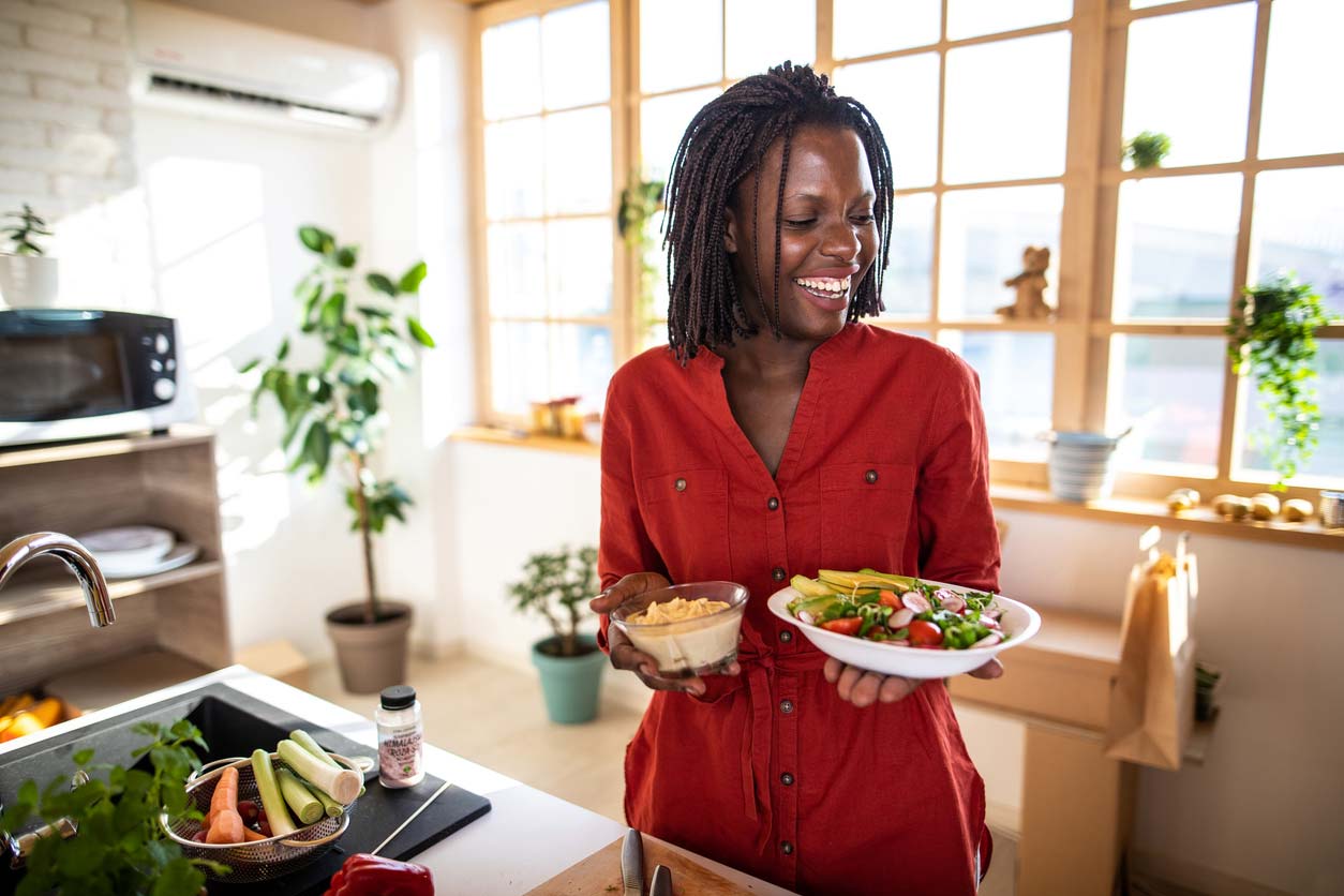 Woman with veggies and dip