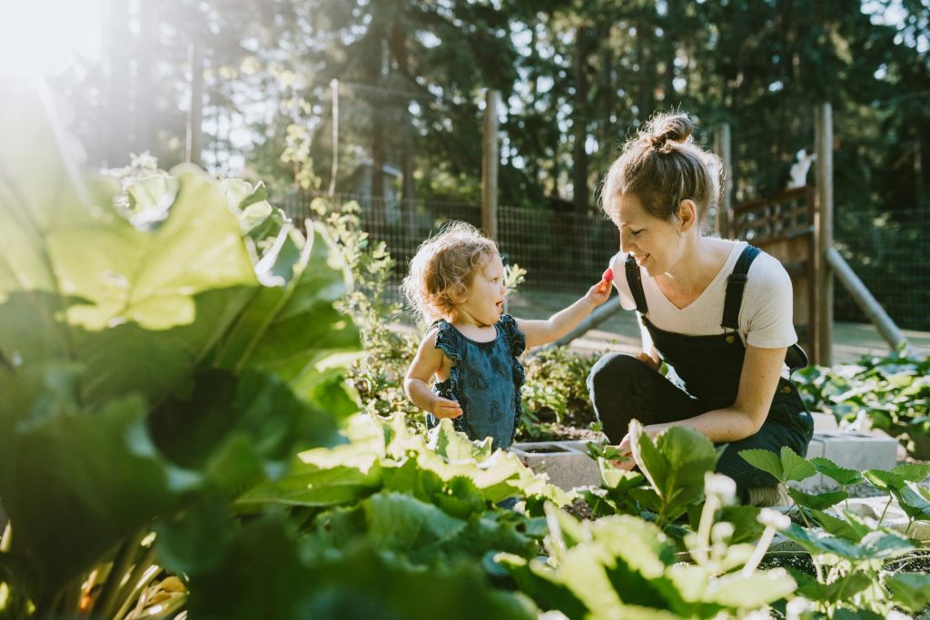 Woman and child in food garden