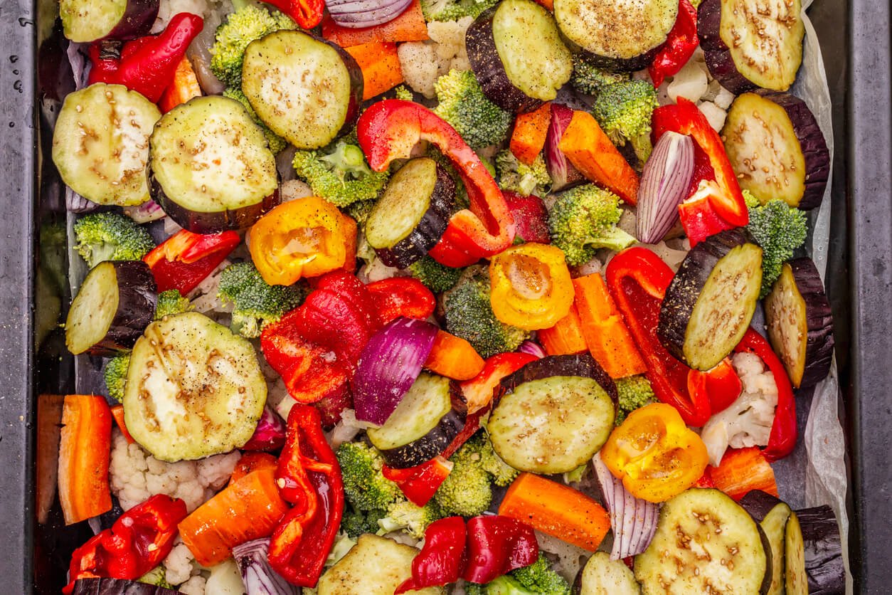 assorted fresh vegetables on a baking sheet healthy food lifestyle salt oil spices