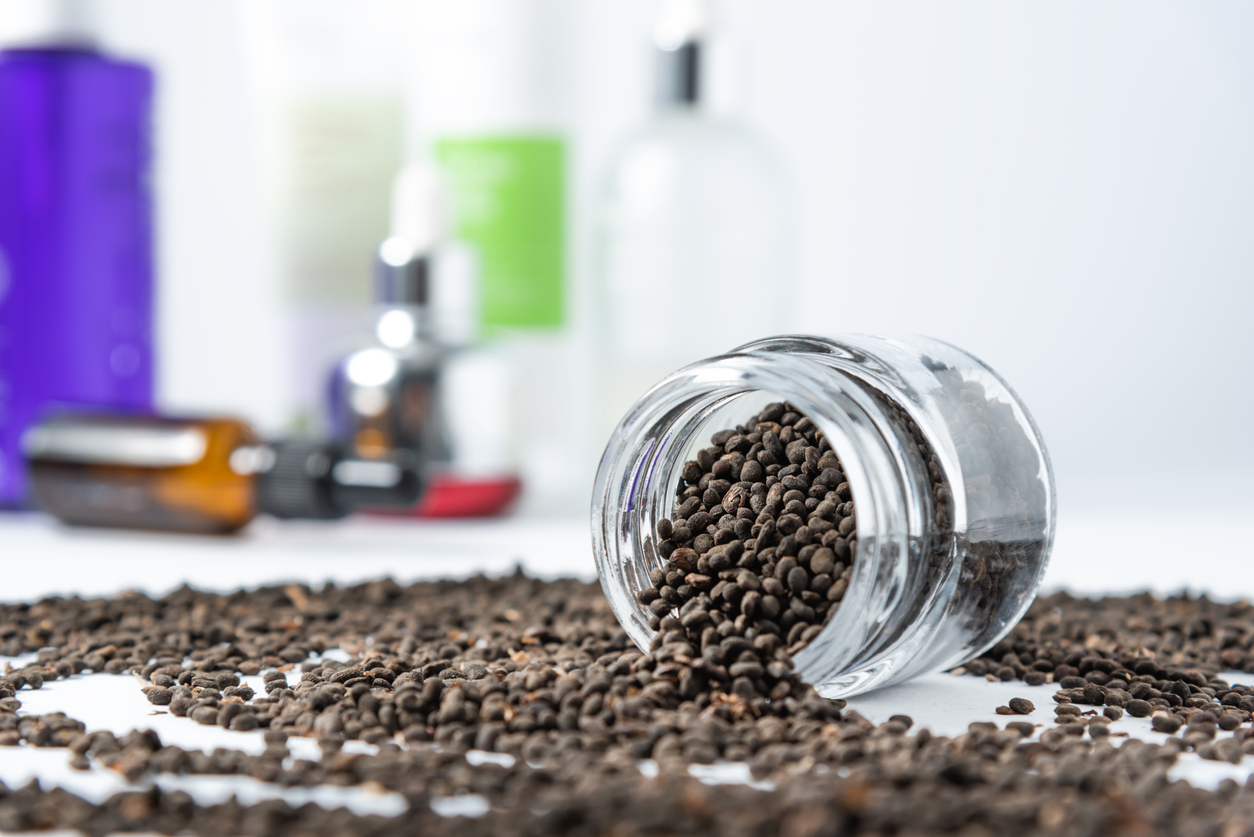Bakuchiol seeds and skin care cosmetics tubes. Retinol alternative ingredient.